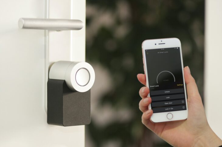 Smart Lock held at the with an iPhone